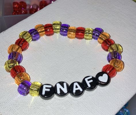 Fnaf Bead Bracelets, Fnaf Kandi Bracelet, Kandi Bracelets Ideas Singles, Kandi Inspo Single, Kandi Singles Ideas Words, Fnaf Gifts, Fnaf Bracelet Ideas, Single Kandi Ideas, Fnaf Diy Crafts