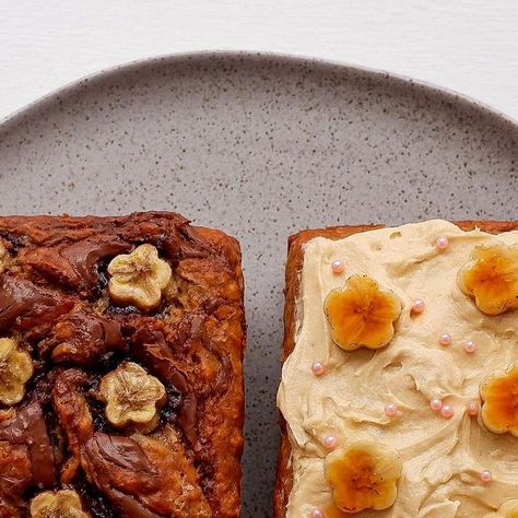 Sayana’s Food on Instagram: ". 💛🤎💛🤎🍌🍌🍌🤎💛🤎💛 ~~~Banana bread two ways~~~ 💛🤎💛🤎🍌🍌🍌🤎💛🤎💛 Nutella swirls throughout or plain & topped with cream cheese frosting and brûléed bananas. Which would you choose? I like my banana bread frostingless 😌 Recipe from Zoe Bakes Cakes #zoebakescakes #zoebakes #bananabread #nutellabananabread #bananadessert #loafcake #foodstyling" Nutella Swirls, Bread Nutella, Zoe Bakes, Nutella Banana Bread, Bread Shop, Banana Dessert, With Cream Cheese Frosting, Loaf Cake, Banana Cake