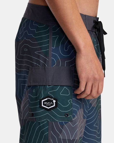 Revamp your beach look with RVCA's Topo Eastern 18" Boardshorts. Crafted of 4-way stretch recycled fabric for total mobility, these Hawaii Collection camo surf trunks feature a gusset fly, side pocket, fixed waist, and drawcord closure for a secure fit. Featured here in the Hawaii Topo Camo colorway.Features Collection: Hawaii collection Fabric: 4-way stretch recycled polyester blend fabric Fly: Gusset fly Waist: Fixed waist Outseam: 18" outseam, mid length Closure: Drawcord closure Pockets: VA patch on side pocket Other Features: Triple needle stitch on front and back rise New Radicals, Surf Wear, Beach Look, Recycled Fabric, Side Pocket, Board Shorts, Mid Length, Camo, Surfing