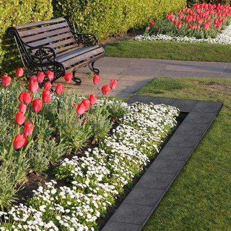 Pathway to Paradise - Drop. Stomp. Done. It's that easy to create a beautiful garden pathway to your favourite outdoor living space. Minutes to install, years to enjoy. Goodbye Gravel - For that barren gravel pathway on the side of your house or the patchy pathway that meanders through your garden, Stomp Stone Pavers provide comfort and style for each step of the way, while smoothing out the rough spots in your garden. Each Stomp Stone measures 12" square, is made from 98% recycled materials, an Patio Stones Pavers, Recycled Rubber Pavers, Rubber Stepping Stones, Paver Steps, Gravel Pathway, Stepping Stone Paths, Grey Slate, Stone Landscaping, Garden Flower Beds