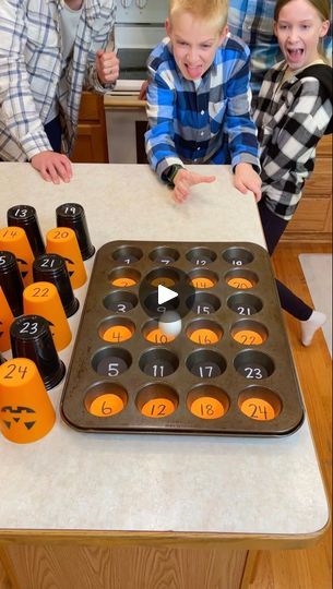 8.9M views · 5K comments | Family Halloween Muffin Tin Game 🎃 | Family Halloween Muffin Tin Game 🎃

Kids, Dad, and whole family play diy Halloween party game with cupcake pan cups, candy, and other fun fall prizes.... | By Benson Bros | Come on. Bounce the ball. Oh.
Oh. Oh. You got number eleven. Which means you get the number
eleven cup. What is it? Oh. A fanta. French fanta. Oh yeah.
Bounce it. Bounce it. Oh you got number nine. Nine. Okay.
She get a nine. What is it? Oh. 1. 1. I'll take it. It's your
turn because and before you go one of these cups has a special
prize that's better than all the rest of the prizes. Okay.
One of the cups has a special prize. Go for it. Go. Go. Go.
Go. Oh. Oh. Oh. You got number fourteen. Which means you have
fourteen. Alright, what did you get? Pick it Cup Flip Game, Muffin Tin Game, Cup Games For Kids, Halloween Muffin, Benson Bros, Funny Christmas Party Games, Diy Halloween Party, Xmas Games, October Crafts