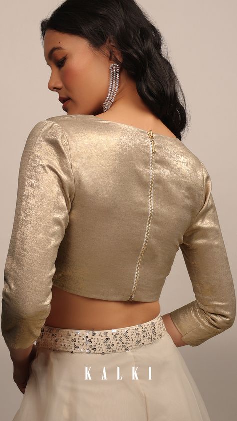 "Introducing our elegant and chic dusty gold blouse, perfect for adding a touch of sophistication to any saree or lehenga.
Crafted from satin material, this sleeveless blouse features a wide plunging V neckline that accentuates your curves and 3/4 sleeves that provide just the right amount of coverage.
The back zip closure ensures a secure and comfortable fit, while the padded design adds an extra layer of comfort and support. Full Sleeve Golden Blouse Designs, Saree Blouse 3/4 Sleeves Design, Golden Blouse For Lehenga, Golden Blouse Ideas, Lehanga Blouses, Golden Blouse Design, Long Sleeve Blouse Designs, Golden Blouse Designs, Gold Blouse Designs