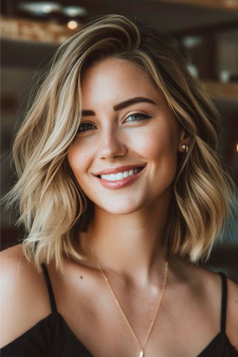 This textured lob with a side part falls gracefully above the shoulders. Soft waves throughout add volume to the classic bob silhouette, and balayage highlights bring a sun-kissed dimension to this layered cut. Click here to see more stunning medium-length layered haircuts. Shoulder Haircut, Layered Haircuts Shoulder Length, Shoulder Hair, Lob Haircut, Shoulder Length Hair Cuts, Haircuts For Medium Hair, Medium Hair Cuts, Shoulder Length Hair, Hairstyles For Women