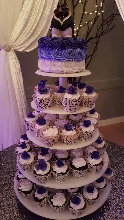 Wedding cake with cupcakes, cake will be blue instead of purple and possibly a different topper Dark Purple Wedding Cake Ideas, Purple Wedding Cake With Cupcakes, Purple Wedding Cake And Cupcakes, Purple And Blue Wedding Cake Ideas, Gold And Purple Wedding Cake, Small Purple Wedding Cake, Sweet 16 Purple And Blue Theme, Purple And Navy Blue Wedding Decorations, Black And Purple Wedding Cake