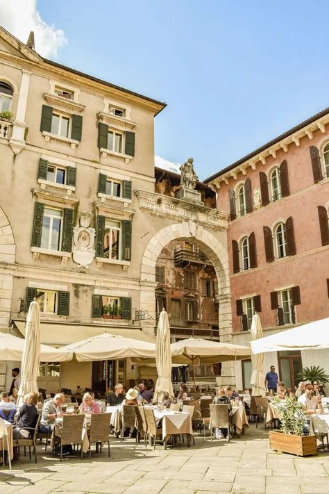 People sitting at cafes in Piazza dei Signori in Verona Italy. Top 10 Things to Do in Verona, Italy. Italy Photography. Aesthetic. #italia #italy Day Trips From Milan, Travel By Train, Italy Culture, Italy Milan, Italy Itinerary, Explore Italy, Verona Italy, One Day Trip, Italy Travel Tips