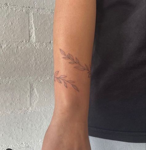 Dainty Wrap Around Arm Tattoo, Womens Arm Wrap Tattoos, Vine Tattoo Dainty, Dainty Vine Tattoo Wrist, Delicate Wrap Around Arm Tattoo, Wrap Tattoos For Women Arm, Leaf Wrap Around Tattoo Wrist, Small Arm Wrap Tattoo, Rap Around Arm Tattoos For Women