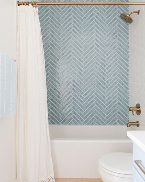 White Tub Blue Tile, Seaside Tile Bathroom, Fun Bathroom Shower Tile, Light Blue Herringbone Shower Tile, Herringbone Tub Tile, Shower Tile Blue Accent, Powder Blue Tile Bathroom, Gray Blue Shower Tile, Blue And White Bathroom Tile Ideas