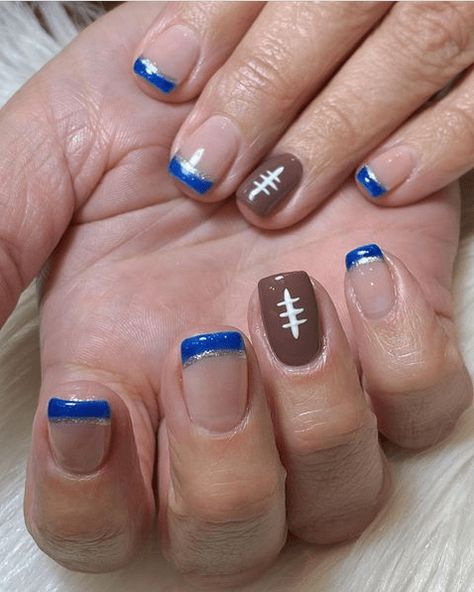 2024's Trendiest Football Nail Designs - Show Your Team Spirit in Style Nail Ideas Football, Team Nails Sports, Football Nail Designs Nfl, Football Nail Art Designs, Nails For Football Season, Football Season Nail Designs, Blue And Gold Football Nails, Cute Football Nails, Cheerleader Nails Designs