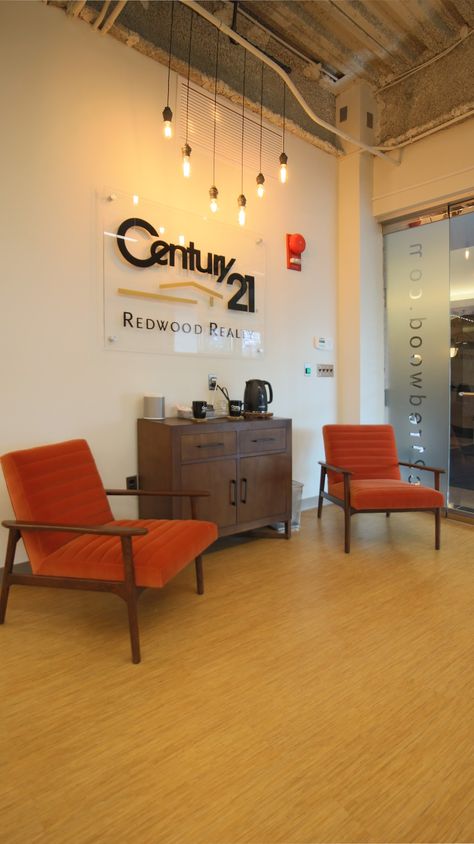 C21 Redwood Realty  Office Reception Area Welcome Area Office, Office Branding Wall Reception Areas, Zen Office Space, Insurance Office, Art Room Inspiration, Zen Office, Office Reception Area, Podcast Studio, Teachers Lounge