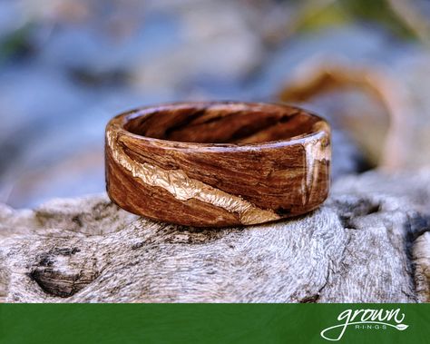 This reclaimed Douglas Fir ring was an antique before I made it. Rescued from a renovation of the historic Normandie Hotel in Los Angeles, CA, this 100 year old Douglas Fir has rich browns and black iron patina. Organic looking veins of Rose Gold accentuate the spiral wood design and warmth of the natural wood colors. This ring makes an ideal wedding band, or gift for him or her. Each and every ring is handmade and to order, so customization of width, style and anything else your imagination can Mens Wooden Ring, Wooden Wedding Rings, Mens Engagement Rings Wood, Mens Wedding Bands Wood, Wooden Engagement Ring, Wood Wedding Rings, Hippie Wedding Ring, Wood Wedding Ring Mens, Bark Wedding Ring