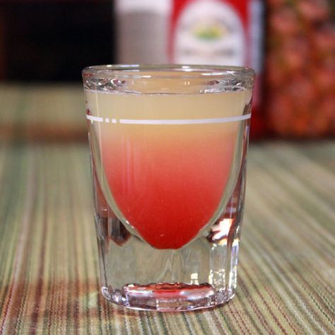 The Pineapple Upside-Down Cake Shot is a fun vodka-based shooter that, while not the most sophisticated drink in the world, is a popular one for parties and nightclubs. It’s a semi-layered shot, with bright-red grenadine at the bottom and pineapple juice … Pineapple Upside Down Cake Shot Recipe, Pineapple Upside Down Cake Shot, Shots Alcohol Recipes, Cake Shot, Strawberry Banana Milkshake, Cake Shots, Shots Alcohol, Vodka Shots, Liquor Drinks