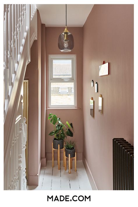 Plaster pink walls brighten the staircase. Add terrazzo planters for an on-trend statement and a pendant light to make the most of vertical space Hallway Decorating Colours, Victorian Terrace Hallway, Hallway Colour Ideas, Hallway Colour Schemes, Pink Hallway, Hallway Paint, Hallway Colours, Hallway Inspiration, Narrow Hallway Decorating