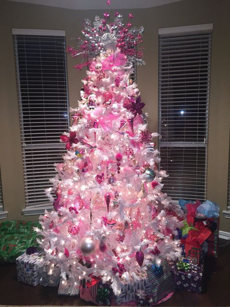 White tree with all pink ornaments. Pink Christmas Tree With Red Ornaments, Sliver Pink Christmas Tree, Decorations For Pink Christmas Tree, Christmas Tree Ideas 2022 Trends Pink, White Christmas Tree Pink Ornaments, White Tree Pink Ornaments, Bright Pink Christmas Tree, Pink Christmas Tree Ideas Decorating, White Christmas Tree With Pink Decor