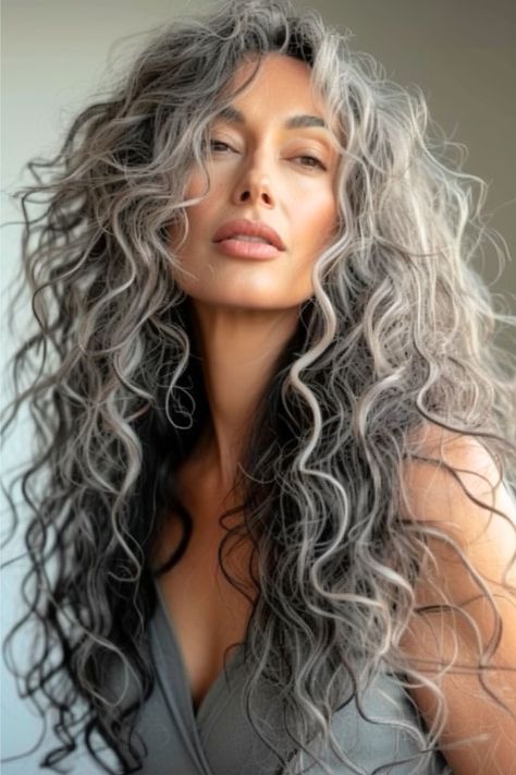 Silver Highlights On Brown Curly Hair, Long Grey Curly Hair Over 50, Long Curly Gray Hair Over 50 Curls, Salt N Pepper Hair Women, Long Grey Curly Hair, Grey Hair In 30s, Permed Hairstyles Long, Wavy Grey Hair, Grey Wavy Hair