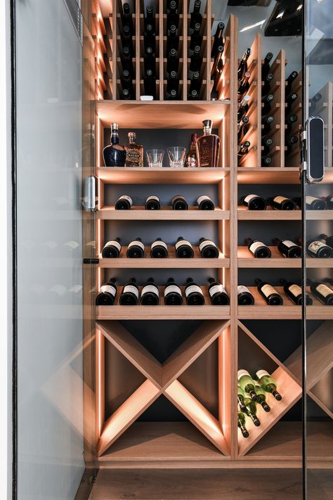 A custom Veneer wine cellar with LED strip lighting encased behind full height glass doors Wine Cellar Lighting Ideas, Wine Display Wall, Wine Cellar Architecture, Cantina Vini, Cave Vin, Wine Walls, Wine Cellar Lighting, Wine Cellar Wall, Bar Casa