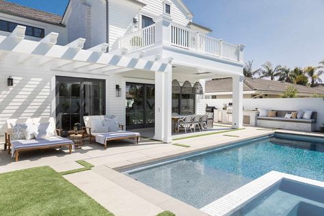 Brandon Architects has designed this sprawling two-story home inspired by a ‘Pennsylvania Dutch’ architectural style, located in Newport Beach, California. Mindy Gayer Design, Fire Pit Seating Area, Clapboard Siding, Dutch Style, Beautiful California, Pool Lounger, Backyard Pool Landscaping, Pennsylvania Dutch, Backyard Spaces