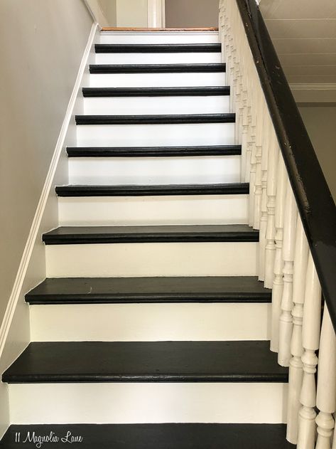 How to paint wood steps with white risers and black treads, white spindles and black banister. Tips and how-to's along with which paint to use and before and after photos. | 11 Magnolia Lane Painted Stairs Black And White, Black And White Stairwell Ideas, Painted Steps Indoors, Paint Steps Indoors, Painting Steps Indoors, Black Steps Stairways, Wood Steps Indoor, Painted Steps Ideas Staircases, Black And White Steps