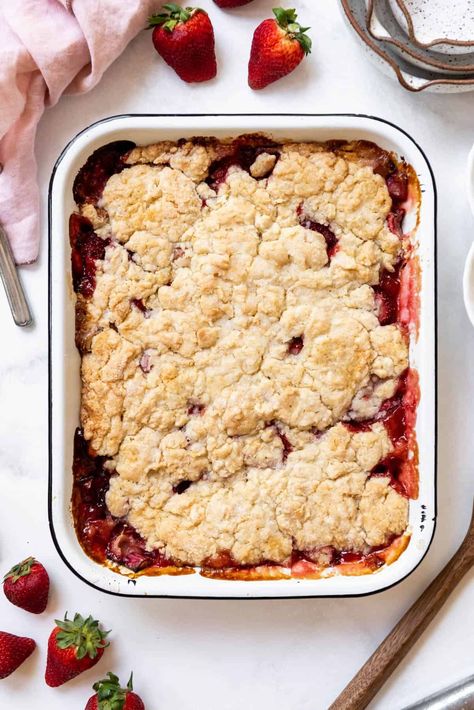 The sweet tart combination of strawberries and rhubarb is a perfect match-up in this Strawberry Rhubarb Cobbler. A buttery sweet biscuit topping is baked on top of a scrumptious filling made with fresh or frozen strawberries and rhubarb for an iconic summer dessert that is ready in under an hour! | strawberry rhubarb cobbler recipe | strawberry rhubarb cobbler recipes | strawberry rhubarb dessert ideas | strawberry rhubarb dessert recipes Cobbler Strawberry, Rhubarb Desserts Recipes, Strawberry Rhubarb Recipes, Strawberry Rhubarb Cobbler, Rhubarb Cobbler, Fruit Desserts Easy, Strawberry Crunch, Cobbler Topping, Rhubarb Desserts