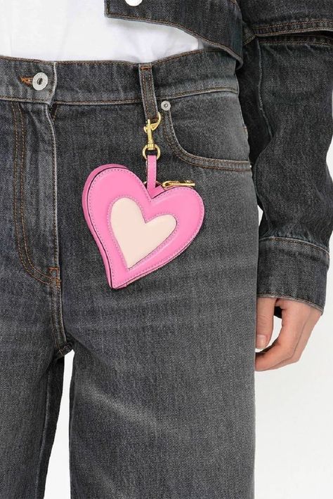 This pink coin purse from JW Anderson's arrives in a heart shape. Its design is crafted from a faux leather blend and features a side zip fastening. #heart #coinpurse Heart Coin Purse, Jw Anderson Bag, Heart Coin, British Fashion Awards, Leather Coin Purse, J W Anderson, Jw Anderson, Engraved Logo, Embossed Logo