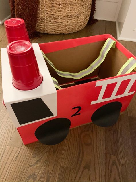 Fire Truck Box Costume, Fire Truck Box Diy, How To Make A Fire Truck From Cardboard, Fire Truck Diy Cardboard Boxes, Diy Firetruck Costume, Firetruck Halloween Costume, Fire Truck Costume Diy, Toddler Fire Truck Craft, Diy Fireman Costume Kids