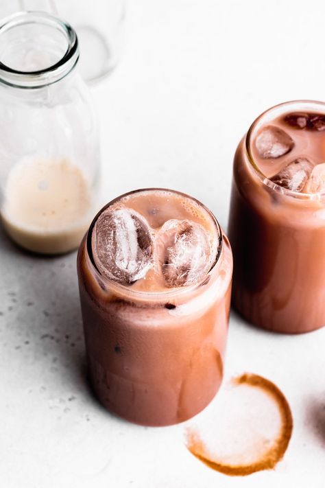 This recipe turns a few simple ingredients into a delicate cold chocolate drink. Iced chocolate is easy to make with all the boosting flavors of a warm chocolate drink in a cold drink. Easy, delicious, and vegan. www.thegreencreator.com - #thegreencreator #vegan #plantbased #icedchocolate #veganchocolatemilk #chocolatemilk #chocolademelk #coldchocolatemilk #veganchocolate #iceddrink Iced Cacao Drink, Chocolate Milk Recipe, Ice Chocolate Drink, Cacao Powder Recipe, Cold Weather Drinks, Cold Chocolate, Iced Chocolate, Cold Drinks Recipes, Milk Chocolate Recipes