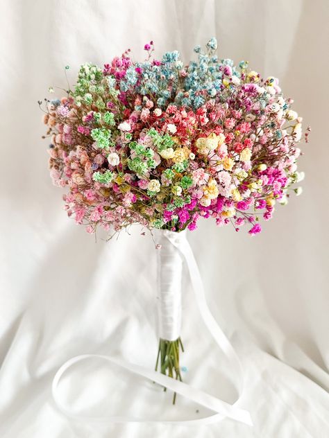 Looking for the perfect way to add a touch of color and beauty to your wedding ceremony? Look no further than our rainbow gypsophila bridal bouquet! This stunning arrangement features a variety of colorful gypsophila flowers, dried baby's breath, Our Gypsophila Bridal Bouquet is perfect for adding a pop of freshness and joy to any special day. Let us help you create the perfect floral tribute for your upcoming wedding. Rainbow Gypsophila bouquet tied with satin ribbon colour of your choice. Bunc Baby Breathes Bouquets, Gypsophila Bridal Bouquet, Gypsophila Bouquet, Prom Bouquet, Flower Cake Toppers, Flower Girl Bouquet, Boquette Flowers, Dried Bouquet, Bouquet Arrangements