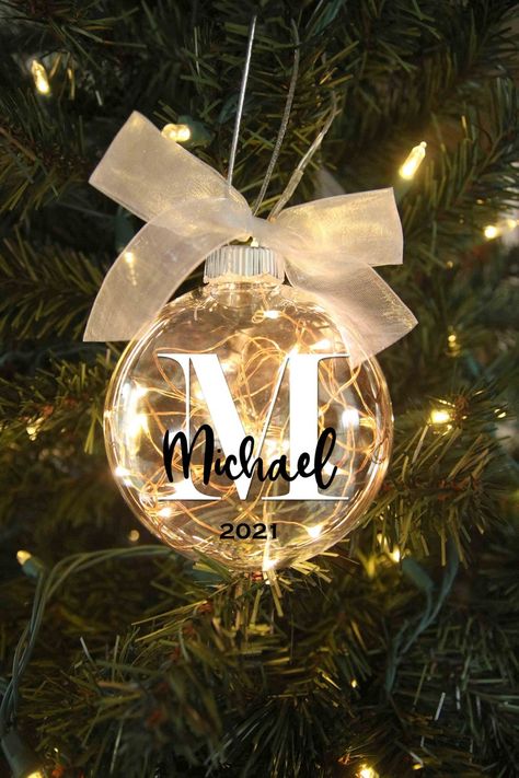 Personalized Lighted Christmas Ornament gift idea for family friends newlyweds parents and grandparents decor idea 2024 Ornaments, Customized Gift Ideas, Name Ornaments, Glitter Ornaments Diy, Idee Cricut, Christmas Light Ornament, Business Christmas, Clear Ornaments, Cricut Christmas