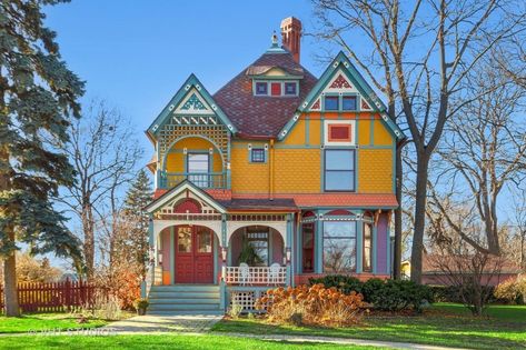 Built in 1890, the four-bedroom house has a raft of original features, including a two-story bay window and lattice along the porch caves. Painted Lady House, Wheaton Illinois, Queen Anne House, Folding Glass Doors, Porch Roof, Pacific Grove, Historic District, Coastal Cottage, Historic Home