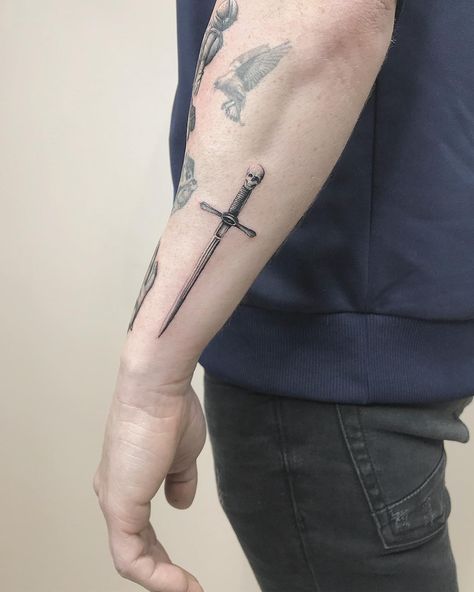 Tattoo Swords Men Arm, Swords Tattoo Men Forearm, Forearm Tattoo Swords, Broadsword Tattoo, Left Hand Tattoo Men, Men Forearm Tattoos Simple, Tattoo Swords Men, Dagger Tattoo Forearm, Men Tattoo Ideas Forearm