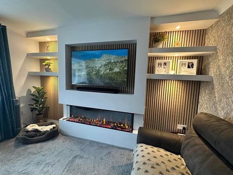 Simply beautiful!😍 Featuring the 1500 slim electric fire from @firezfires , slat wall panelling finished in natural oak and dimmable downlighting to suit any mood, this media wall has completely transformed the main living area of this lovely family home🏡 To find out more about how we could make your dream space a reality simply visit our website: 🌍 www.tynesidehome.co.uk Call into our Hebburn showroom at: 🏠75 Station road, NE31 1LA Or contact a member of our team on: 📧 enquiries@tyne... Slat Media Wall, Oak Slat Wall, Media Walls, Electric Fire, Wall Panelling, Lovely Family, Electric Fires, Media Wall, Slat Wall