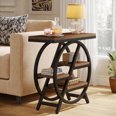 Elevate your living space's aesthetics with our narrow end table, a sleek, industrial style contrasted with metal frames, and a warm wooden finish. Featuring three storage shelves, this versatile end table for the living room provides ample space for decor elements, picture frames, books, and other personal items. This slim piece of furniture not only works perfectly as a side table for your living room, adjoining your sofa or favorite armchair, but it also doubles as an elegant nightstand or be Tiny Side Table, Staggered Shelving, Slim Side Table, Brown Side Table, Narrow Side Table, Side Table Set, Bedside Table Design, Small End Tables, Room Aesthetics