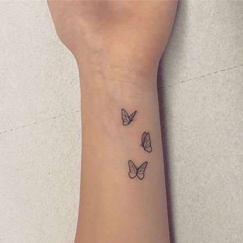 Creative Minimal Tattoo, Minimalistic Small Tattoo, Minimal Tiny Tattoo, 3 Tiny Butterfly Tattoo, Small Minimal Tattoos For Women, Gemini Ear Tattoo, Tattoos For Women Minimal, Minimal Hand Tattoos For Women, Tattoo Ideas For Arms For Women