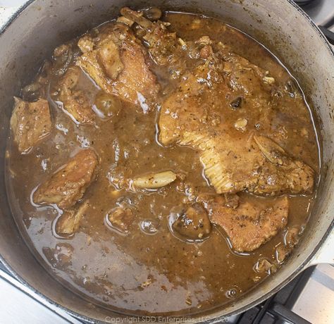 Cajun Smothered Pork Chops epitomizes Cajun cooking. Simple methods extracting every bit of flavor from the ingredients. Pork chops with Cajun seasonings are simmered slowly with onions in wine and stock until the pork is fork-tender and the gravy is thick and deep in flavor. Cajun comfort food at its best! Rice And Gravy Recipes Cajun, Cajun Cooking Recipes, Cajun Comfort Food, Cajun Seasonings, Pork Chops Smothered, Roaster Recipes, Creole Food, Rice And Gravy, Pork Chops And Gravy