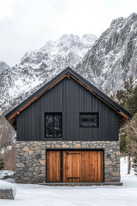 Barn style modern mountain house with stone foundation rustic slatted facade barn door with rusted accents imposing Scandinavian mountains in the background winter. Check out all of these amazing modern rustic mountain houses to blend natural charm with contemporary flair. Nordic Barn House, Mountain Cabin Exterior, Scandinavian Barn House, Western Style House, Winter Cabin In The Woods, Scandinavian Mountains, Hunting House, Modern Craftsman House, Modern Barn Style