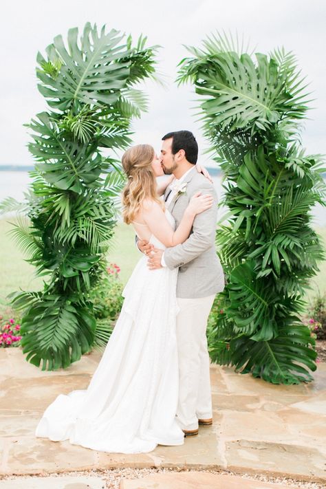 Palm leaf ceremony backdrop Wedding Arch Palm Leaves, Tropical Wedding Arbor, Palm Leaf Decor Wedding, Palm Leaf Wedding, Tropical Themed Wedding, Tropical Leaf Decor, Wedding Gate, Tropical Wedding Bouquets, Wedding Flower Guide