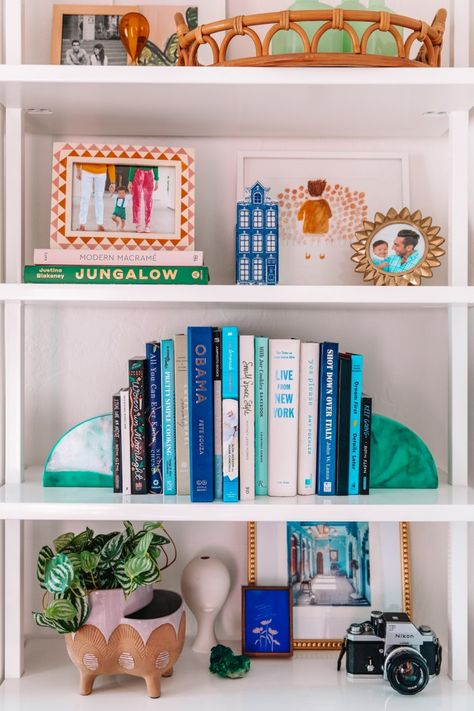 Library Shelf Styling, Shelf Decor Living Room Colorful, Gold Shelf Decor Living Rooms, Colorful Bookshelf Decor, Eclectic Bookshelf Styling, Curated Bookshelves, Office Bookshelf Styling, Eclectic Shelf Decor, Bookshelf Wealth