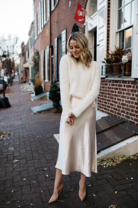 Wedding Dress And Sweater, Winter Dress Rehearsal Outfit, Engagement Sweater Dress, Outfit Inspo Winter Dress, Bridal Skirt And Sweater, Sweater Dress 2022, Cold Weather Rehearsal Dinner Outfit, White Party Dress Winter, Satin Dress And Sweater Outfit