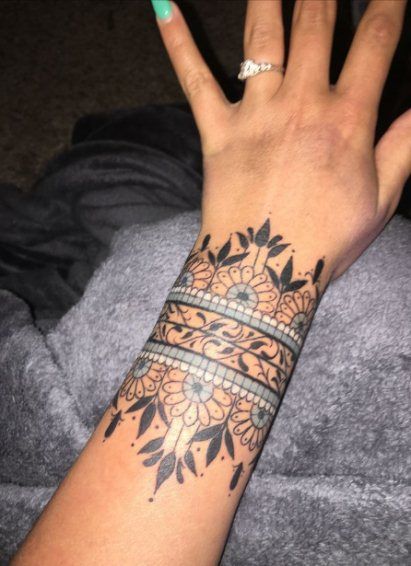 30+ Bold & Beautiful Tribal Tattoos For Women | Spiritustattoo.com Cuff Tattoo Wrist, Wrist Cuff Tattoo, Tato Mandala, Mandala Wrist Tattoo, Wrist Band Tattoo, Wrist Tattoos Girls, Tattoo Band, Unique Wrist Tattoos, Cuff Tattoo