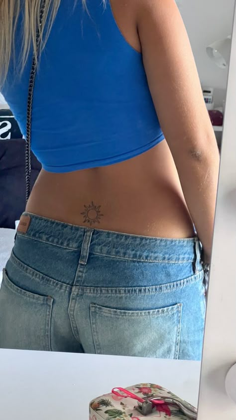 Lower Back Ocean Tattoo, Strap Stamp Tattoo, Tramp Stand Tattoo Ideas, Above Buttcrack Tattoo, Sun Lower Back Tattoo, Henna Tattoo Designs Stomach, Back Waist Tattoo For Women, Bottom Of Back Tattoo Women, Tattoo Ideas Female Lower Back