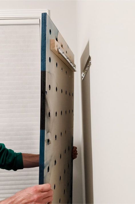 Make your own pegboard from plywood! Pegboards are a great way to display and organize pretty much anything! Hair Peg Board, Diy Gym Pegboard, Peloton Pegboard, Pegboard Diy How To Make, Pegboard Shoe Rack, Home Gym Pegboard Storage, Peg Board Gym Organization, Peg Board Entryway Ideas, Home Gym Pegboard