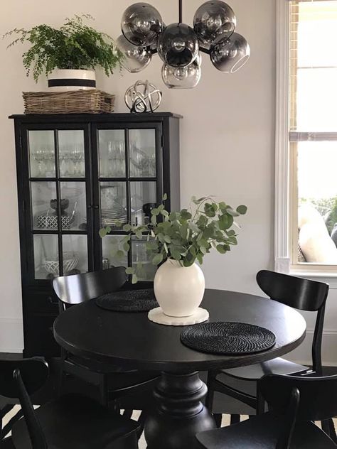 Dark Round Kitchen Table, Black Table Centerpieces Dining Rooms, Black Dining Set Decor, Black Furniture Dining Room Ideas, Black Farmhouse Table Dining Room, Black Dining Table With Black Chairs, Black Circle Dining Table Decor, Black Round Kitchen Table And Chairs, Centerpiece Round Table Dining Room