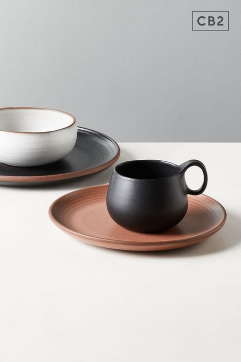 Natural terracotta peeks through at the base of this glazed matte black mug. Rounded silhouette and circle handle are inspired by the shapes of Japanese pottery. Madera dinnerware collection mixes neutral glazes and natural edges for a fresh take on dinner service. Elegant Tea Set, Black Tableware, Natural Edges, Ceramic Cutlery, Circle Handle, Pinch Pots, Dinner Service, Natural Edge, Fruit Infused