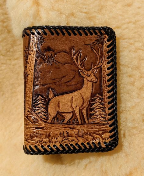 This is a trifold wallet with a hand carved and tooled wildlife scene.  It is from a bifold pattern that I altered to fit the trifold wallet. It is finished with a Briar Brown stain over an acrylic blockout for contrast and to enhance detail. This wallet is laced  with dark brown leather lace using the double loop stitch. The dark brown leather interior features 3 horizontal credit card pockets on the right, and 3 vertical credit card pockets in the center, with a clear vinyl insert for ID on the left.  There is also a pocket under each set of credit card slots, and a roomy cash pocket the length of the wallet. Folded dimensions are 3-1/2 x 4-7/8. It is also lined with RFID shield paper to help prevent identity theft from scanners. Wallet Tool, Buck And Doe, Fawn Design, Leather Tooling Patterns, Tooling Patterns, Handmade Leather Wallet, Clip Wallet, Luxury Wallet, Money Clip Wallet