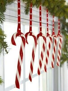 Hang candy canes in kitchen window by katie Christmas Decor Diy Cheap, Dollar Store Christmas Decor, Candy Cane Decorations, Cheap Christmas Diy, Christmas Window Decorations, Dollar Store Christmas, Diy Christmas Decorations Easy, Candy Cane Christmas, White Candy