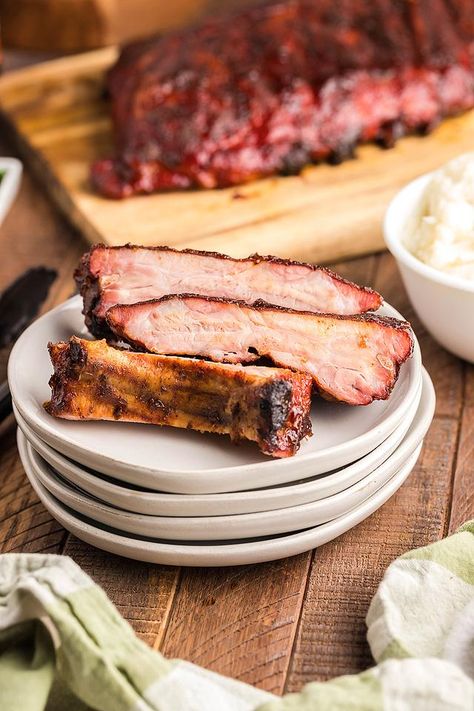 I love smoked baby back ribs! They are rich, meaty and such an easy grilling recipe to master. If you’ve never had smoked ribs made in a Traeger grill or other pellet griller you’re missing out! Read on for this unbelievably good BBQ rib recipe that will become a summer BBQ favourite. Believe me, there are never leftovers when you make this tasty but easy grilling recipe. If you are a fan of fall of the bone ribs, these are for you! #babybackribs #ribs #bbq #smoker #grill #traeger #pelletgrill Grill Ribs, Babyback Ribs Recipe, Smoked Baby Back Ribs, Grilled Baby Back Ribs, Bbq Baby Back Ribs, Bbq Recipes Ribs, Backyard Grill, Barbeque Recipes, Easy Grilling Recipes