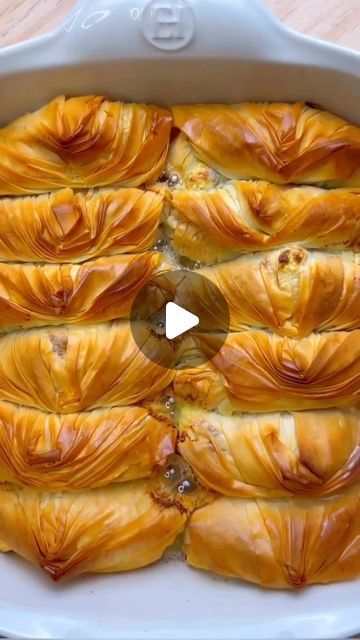 Sydney Authentic Ashta Creamery | TAREW Creamery on Instagram: "@hello_its_amani shows us how to make her  Ashta and pistachio baklava rolls using our authentic ashta 😍

Ingredients:
✔️1 packets of @antonioufillopastry fillo pastry
✔️7 1/2 kg of Ashta ( clotted cream )
@tarekabdelrahimelwazzicreamery
✔️1 cup of ground pistachio cup
✔️1 cup of Melted ghee
✔️Sugar syrup (recipe below)

Method:
 ▪️Preheat your oven to 200 °C
▪️Brush your baking dish with melted ghee
▪️Lay one sheet of fillo pastry, crinkle it, then fold it in half making sure one part is overlapping the other part.
▪️Put 1 tsp of ground pistachio in the bottom centre then top it with a heaped teaspoon of clotted cream (Ashta)
▪️Fold the sides and roll tight until you close it off like the video
▪️Place it into your baking
▪️ Baklava Rolls, Filo Pastry Recipes, Pistachio Baklava, Lebanese Cuisine, Sugar Syrup, Clotted Cream, Syrup Recipe, Baking Dish, Baklava