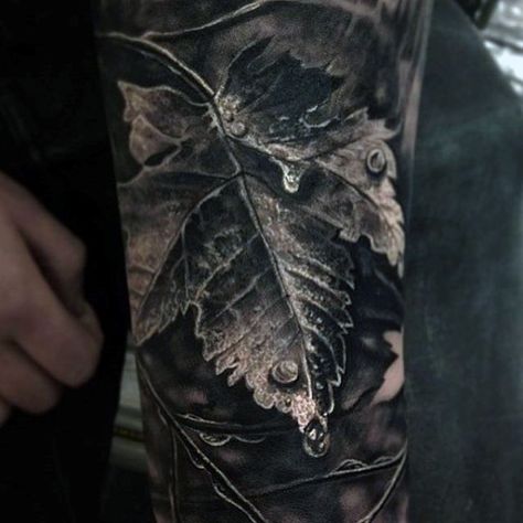 Brilliant Grey Colored Leaf And Dew Drop Realism Tattoo Mens Sleeve Natur Tattoo Arm, Blatt Tattoos, Nature Tattoo Sleeve, Autumn Tattoo, Leaf Tattoo, Full Sleeve Tattoo Design, Omerta Tattoo, Forest Tattoos, Realism Tattoo