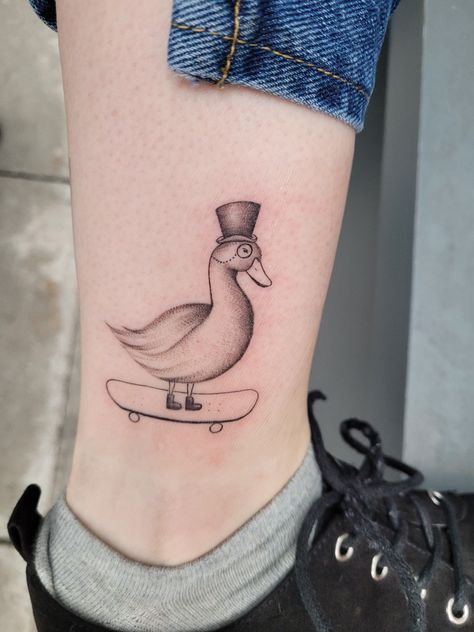 Tattoo duck skateboard monocle ankle fine line top hat Duck Skateboarding Tattoo, Duck With Hat Tattoo, Duck On Skateboard Tattoo, Animals On Skateboards Tattoo, Goose Tattoo Traditional, Monocle Drawing, Duck On A Skateboard, Goose Drawing, Goose Tattoo