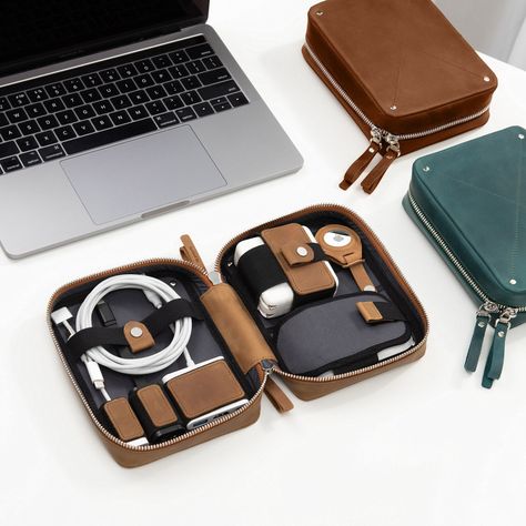 "For tech-minded people, this personalized cable organizer travel case is a must. Clamshell-styled, it unzips flat to offer easy access to what you need on the move. Going with a range of multi-purpose compartments, cord organizer smartly and compactly stows gadgets preventing them from floating around or scratching. 2-way zip ensures effortless devices charging without their removal and safe storage. Sleek and versatile, you can stash a leather cable pouch in a travel bag or grab it daily. ✔️ DETAILS: *  Crazy Horse leather *  lined interior and enhanced corpus *  multi-purpose compartments, pockets, and loops *  2-way smooth-pulling zip *  3 sizes available ❗❗ Please, keep in mind that this listing is for a leather travel cord organizer - all devices on photos are not included, and these Cord Organization Travel, Tech Organizer, Charger Organizer, Tech Organization, Tech Pouch, Tech Bag, Cord Organizer, Cord Ties, Cord Organization