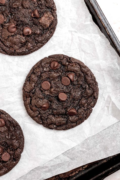 Indulge in these deliciously rich and decadent double chocolate chip cookies. These cookies are made without eggs so they're perfect for anyone with dietary restrictions too! These cookies are packed with gooey chocolate chips and lots of cocoa powder. Get the recipe here! Eggless Double Chocolate Chip Cookies, Chocolate Chip Cookies Egg Free, Baked Goods Without Eggs, Chocolate Chip Cookies No Eggs Recipes, Eggless Christmas Cookies Recipes, Eggless Baked Goods, Chocolate Chip Cookies Recipe No Egg, Chocolate Cookies Eggless, Chocolate Cookies Without Eggs